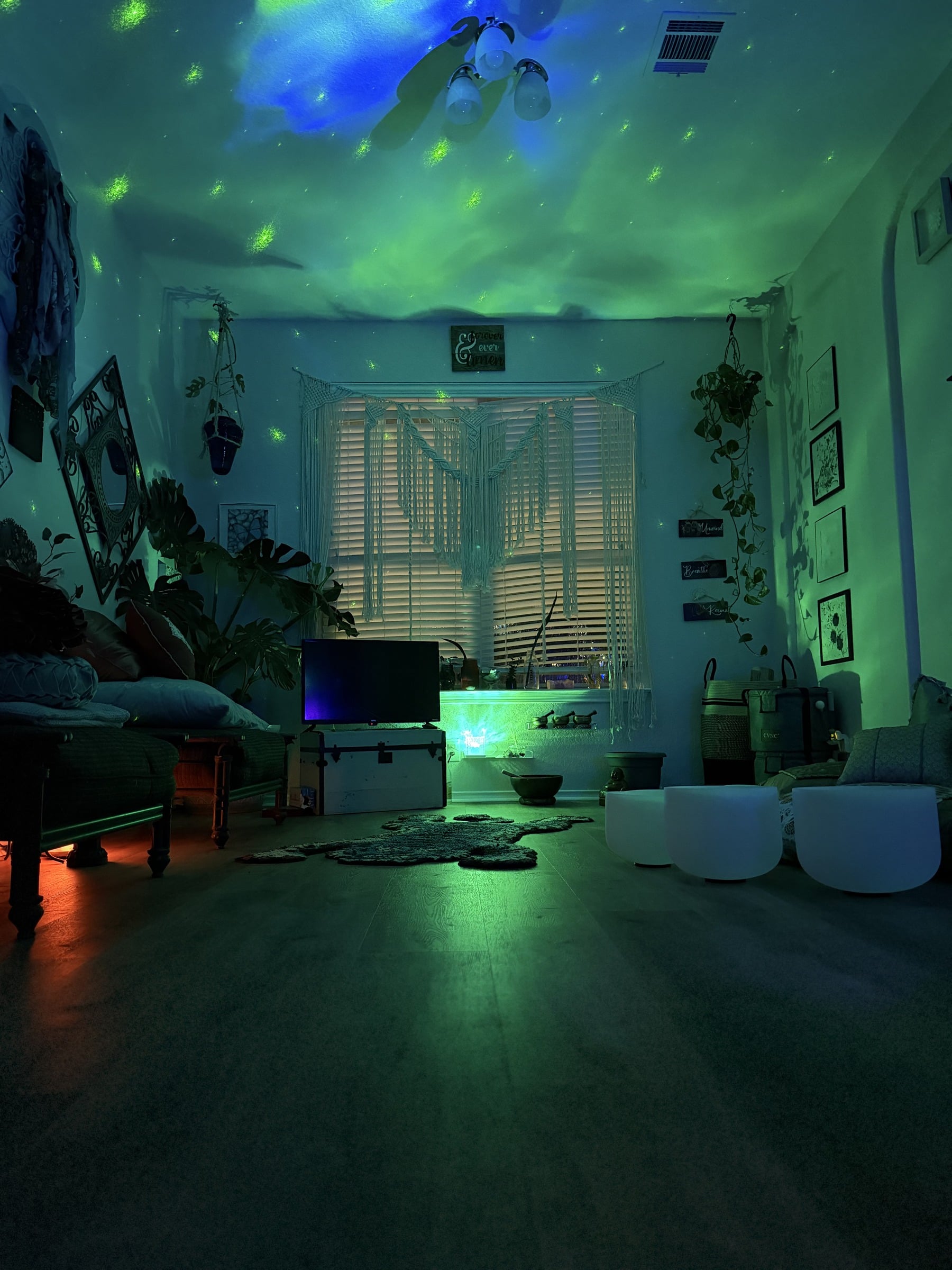 A calm Healing River House room with soft blue-green lighting