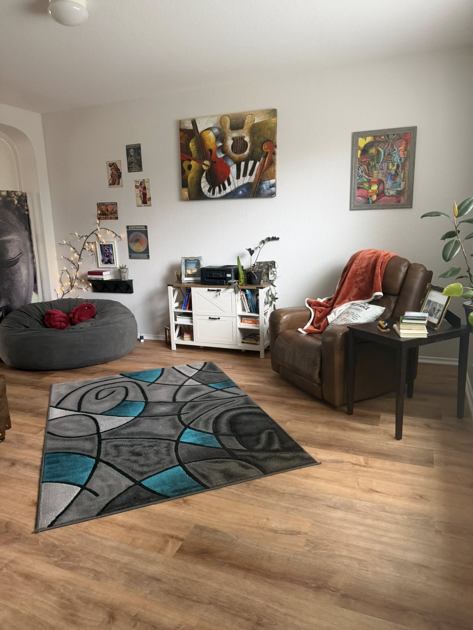 Warm shared living room with art and quiet seating